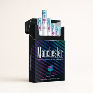 Manchester Double Drive Cigarettes cigarette pack on a warm-white studio background