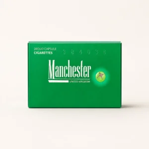 Manchester Green Crush Cigarettes cigarette pack on a warm-white studio background